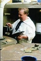 Chief Cook Johnstone at work in the galley.